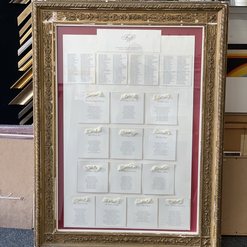 Wedding seating plan featuring a gold painted pre-finished moulded picture frame